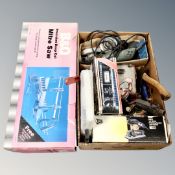 A box of battery chargers, power tools, hand tools,