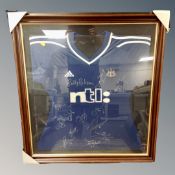 An NUFC Team signed football shirt in display frame