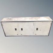 An industrial three door cabinet