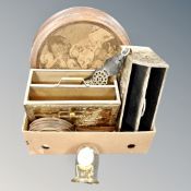 A box of two brass magazine racks, horse brasses, anniversary clock,