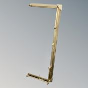 A brass telescopic fire curb