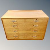 A teak effect five drawer low chest,