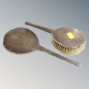 A silver backed hair brush and dressing table mirror,