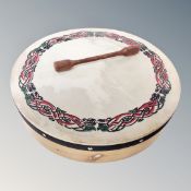 A bodhran with beater,
