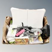 A Nintendo Wii with controllers, leads, Wii fit board,