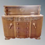 A 1930's carved oak buffet sideboard,