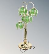 A contemporary brass lotus flower table lamp