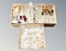 Three boxes of glass including decanters, pint glasses etc.