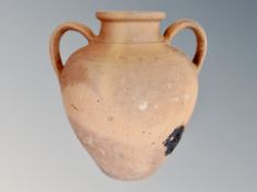 Two antique terracotta twin-handled urns,