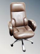 A brown leather swivel chair