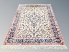 A machine made carpet of Persian design,