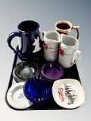 A tray of ceramic whisky jugs,