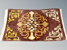 A Chinese fringed rug 100 cm x 56 cm10