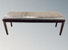 A pair of stitched brown leather three seater benches width 140 cm