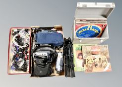 Two boxes containing camera tripods, camcorders, video cameras, cable,