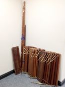 A mid century set of teak floating shelves comprising of 24 shelves each width 80 cm