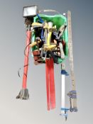 Two metal clamps together with a site light and box of hand tools