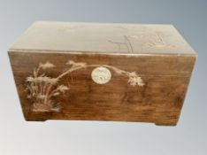 An early 20th century camphor wood coffer,