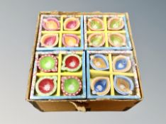 A box of 24 Diwali traditional oil lamps, in packs of four.