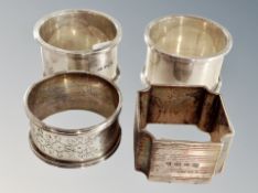 Four silver napkin rings.