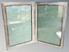 A silver double photograph frame,