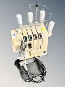 A Singer 14 U134 electric sewing machine with plug and lead