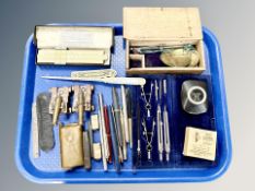 A precision drawing set, writing utencils including Shaffer fountain pen with yellow metal nib,