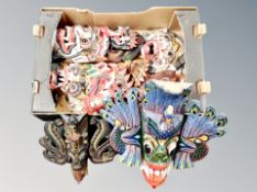 A box of hardwood hand finished wall masks