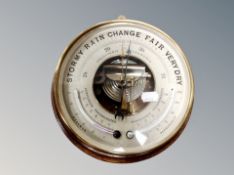 An Edwardian oak backed holosteric barometer together with a reproduction nautical clock
