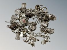 A silver charm bracelet CONDITION REPORT: 101.