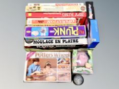 A collection of vintage boardgames, potter's wheel etc.