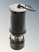 A 19th century steel and brass miner's lamp