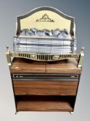 An electric fire together with Philips hostess trolley