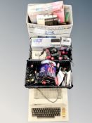 An Atari 800 computer box and two crates containing Atari computer systems, joy sticks,