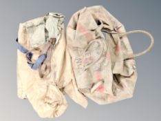 A naval canvas holdall containing canvas bag and belts