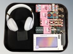 A pair of Beats cordless headphones,