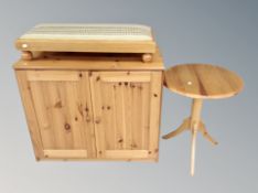 A contemporary pine double door cabinet together with pedestal wine table and duet footstool