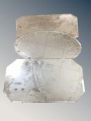 Three frameless bevelled mirrors