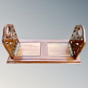 A Victorian Scottish walnut book slide, the carved end panels depicting thistles,