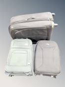 A Samsonite green luggage case and two further luggage cases