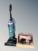 A 20th century Singer electric sewing machine in case together with Hoover upright vacuum