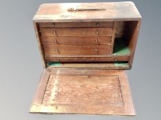 A vintage oak machinist's tool box fitted with drawers