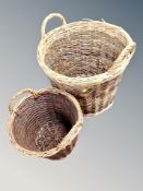 Two graduated twin handled wicker baskets