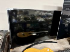 An LG model 50UM 7450PLA LCD TV with lead and remote