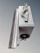 A Sony subwoofer with sound bar and remote