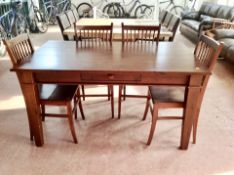 A contemporary pine dining table fitted with a drawer together with a set of four rail backed