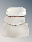 Three frameless bevelled mirrors