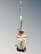 A Chinese porcelain crackle glaze table lamp on wooden stand