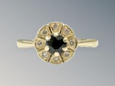An 18ct gold sapphire and diamond cluster ring, size M CONDITION REPORT: 3.