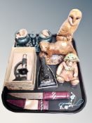 A tray of knife in leather sheath, antique cast flat iron, student microscope,